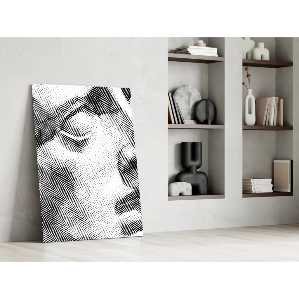 Black and white halftone portrait on glass wall art leaning against wall