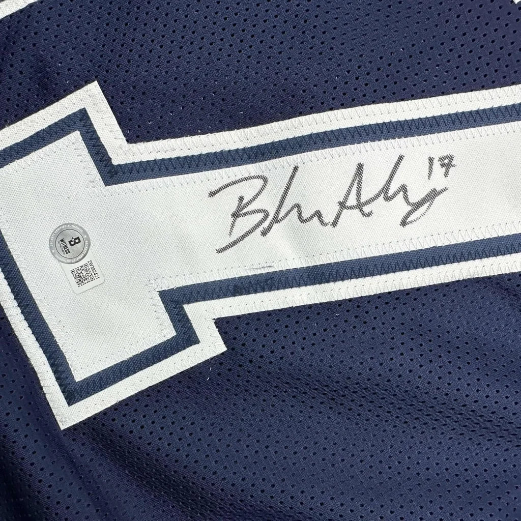 Signed blue and white football jersey in premium frame