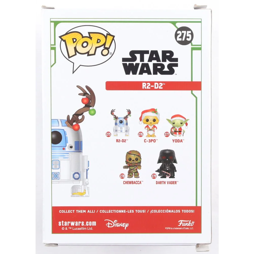 Back of a Funko Pop R2-D2 Holiday Edition box with collectible figures and Signed Christine Galey bobble head