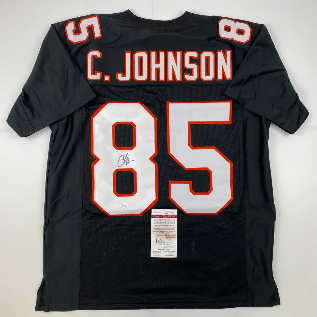 Black C Johnson custom jersey with orange and white accents signed by the pro sports star