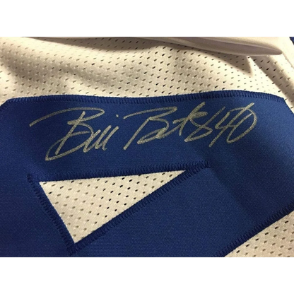 Framed signed Dallas Cowboys jersey in blue and white with green autograph