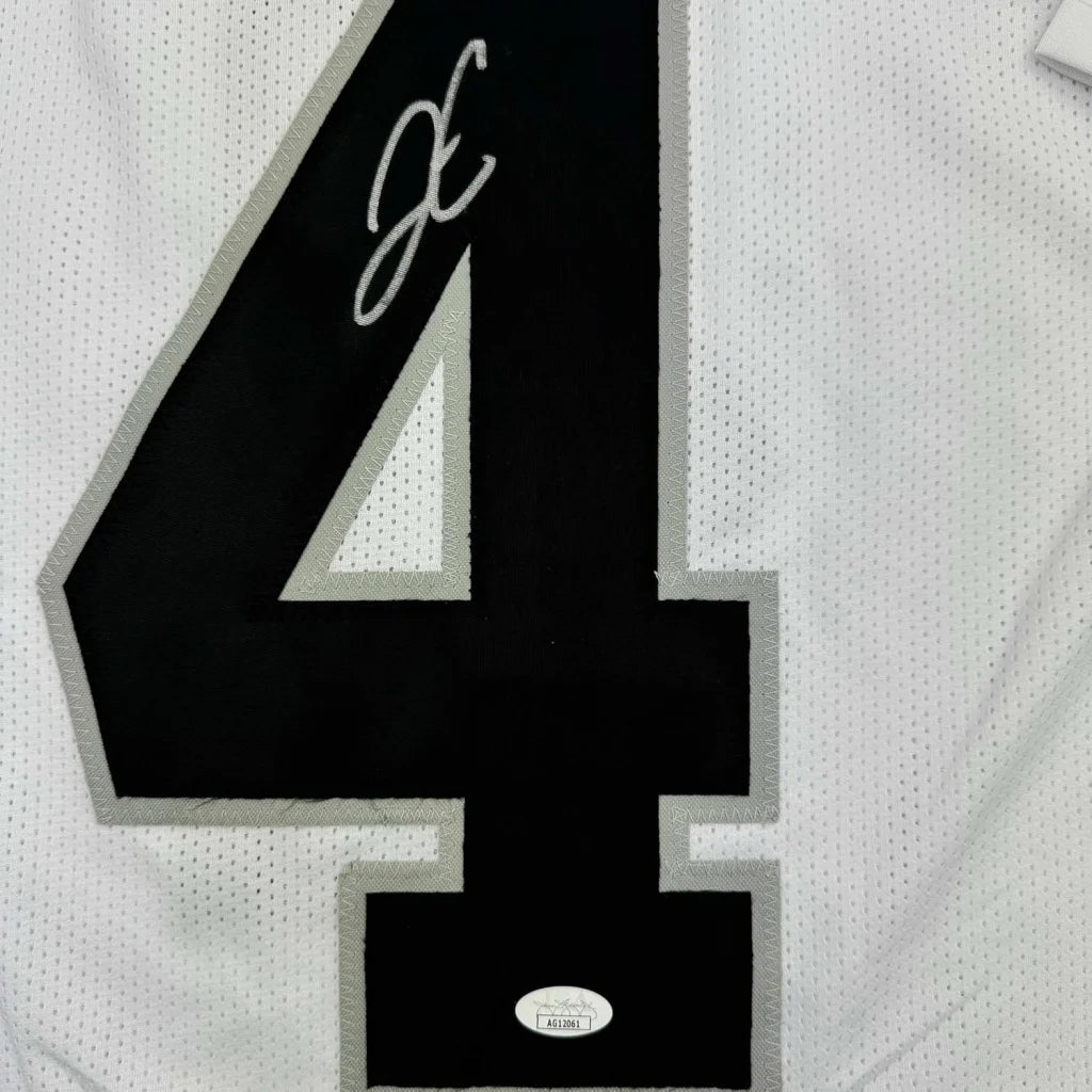 White Derek Carr Raiders jersey with black number 4 and signature, ready to hang
