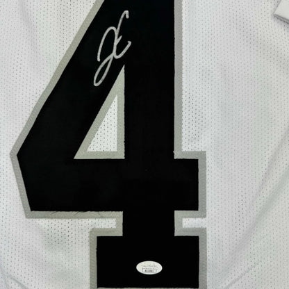 White Derek Carr Raiders jersey with black number 4 and signature, ready to hang