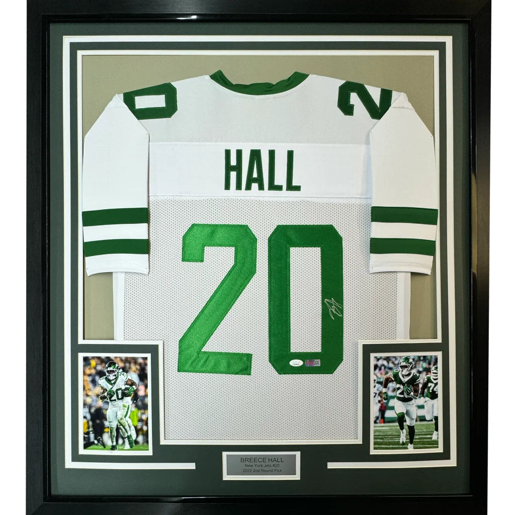 Framed white and green autographed football jersey with player photos for Man Cave display