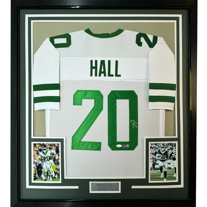 Framed white and green autographed football jersey with player photos for Man Cave display
