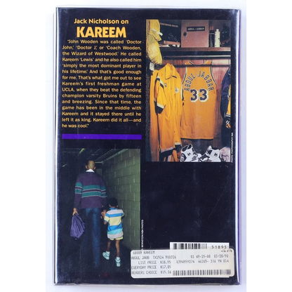 Kareem hardcover book featuring basketball player, text, and images on back cover