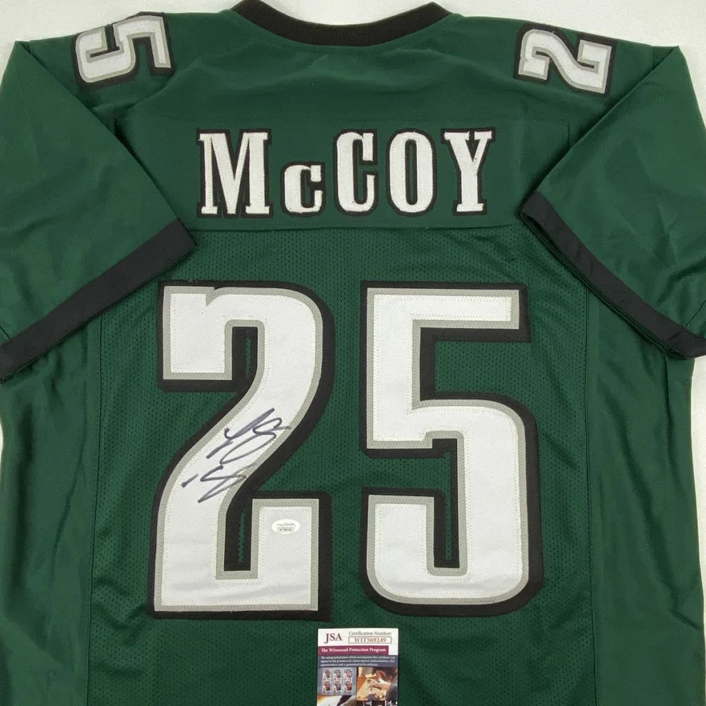 Autographed green custom football jersey with number 25 from professional sports league