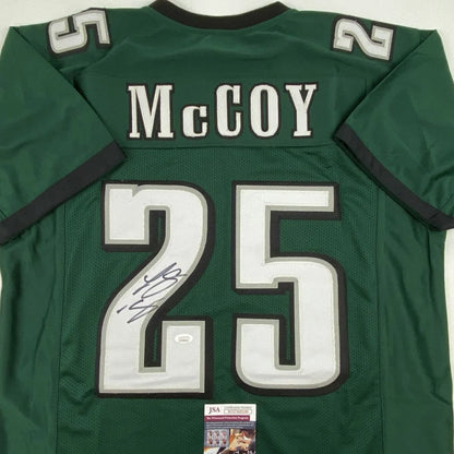 Autographed green custom football jersey with number 25 from professional sports league