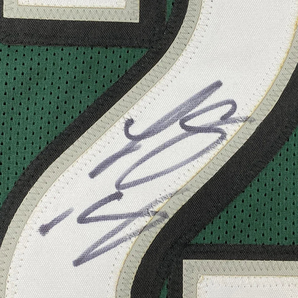 Autographed green and white custom jersey from a professional sports league collectible