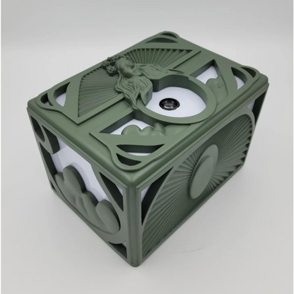 Ornate olive green signed platinum box with mermaid figure and concept art prints inside