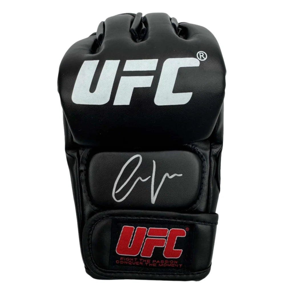 Signed black UFC boxing glove with signature on palm and wrist strap