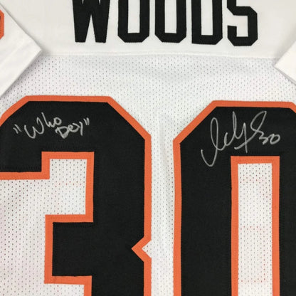 White custom jersey from professional sports league with black orange numbers and autographs