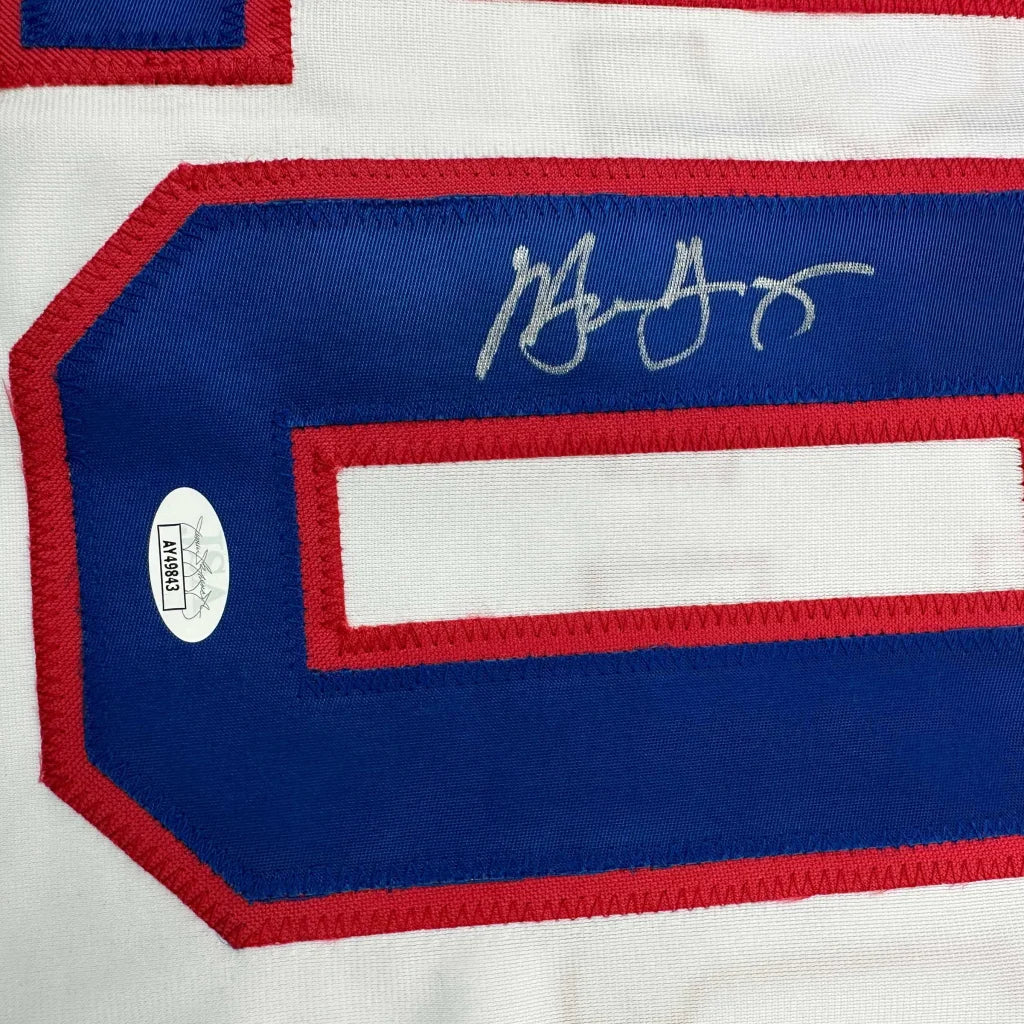 Autographed custom jersey with certification sticker from a professional sports league
