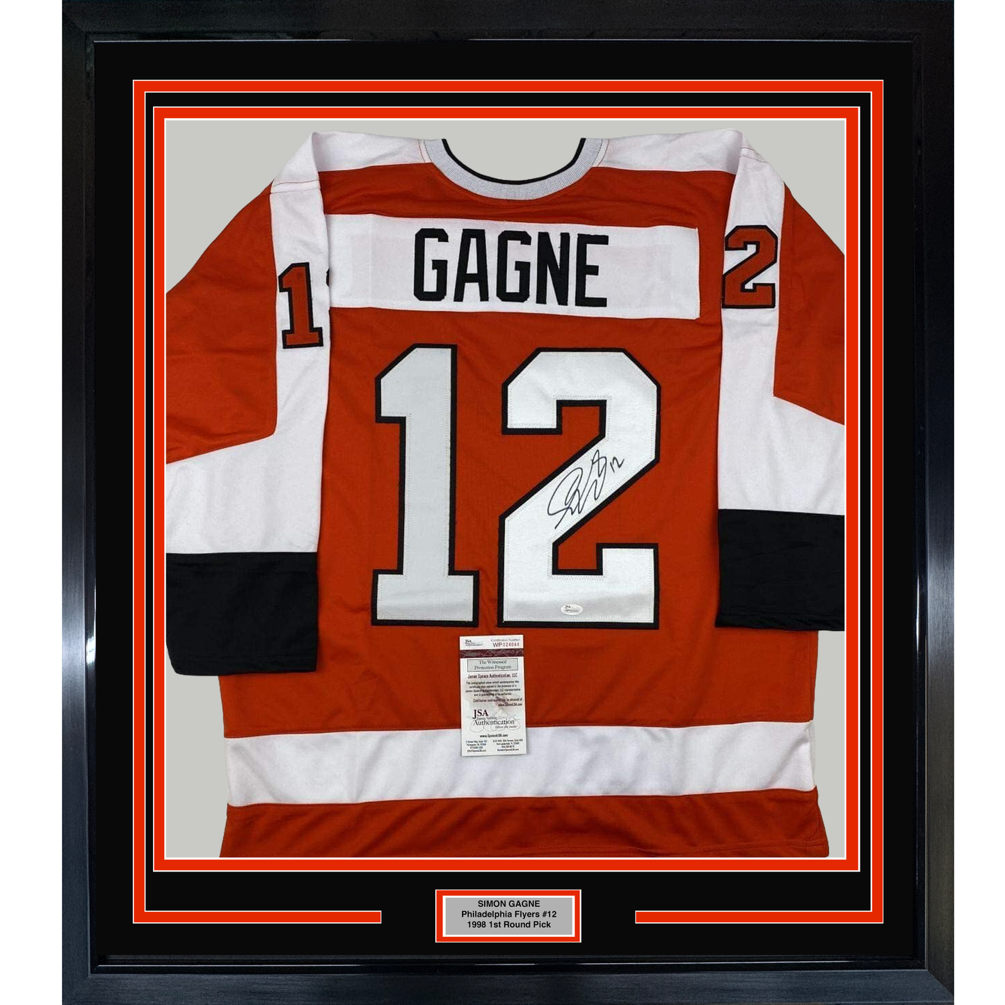 Framed red and white Philadelphia Flyers hockey jersey number 12 with "GAGNE" nameplate and autograph, displayed flat against black matting with JSA authentication certificate visible.