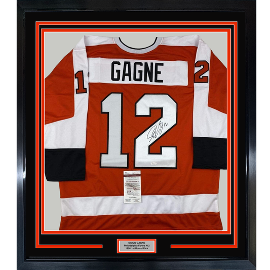 Framed red and white Philadelphia Flyers hockey jersey number 12 with "GAGNE" nameplate and autograph, displayed flat against black matting with JSA authentication certificate visible.