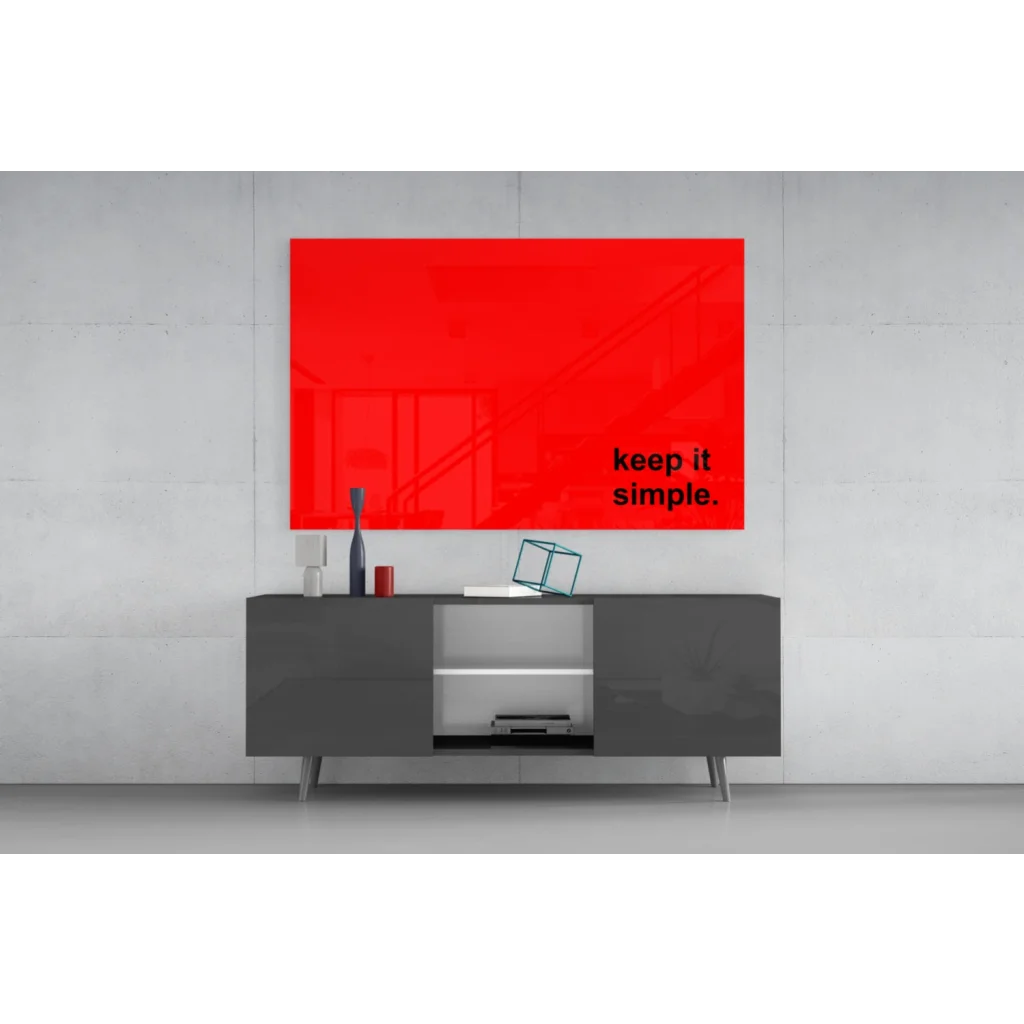 Vibrant red glossy glass wall art with Keep it simple phrase