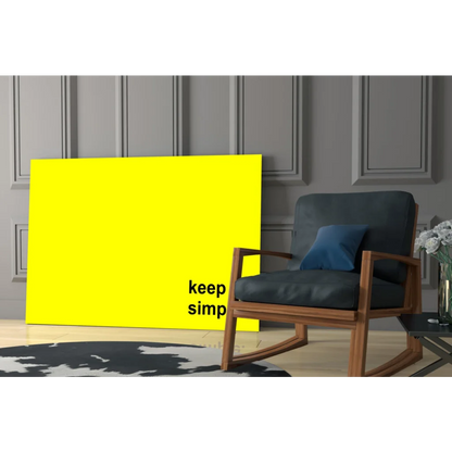 Bright yellow Keep It Simple canvas wall art print on gray wall