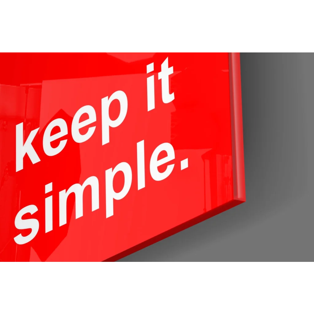 Glossy red glass wall art with bold Keep It Simple text