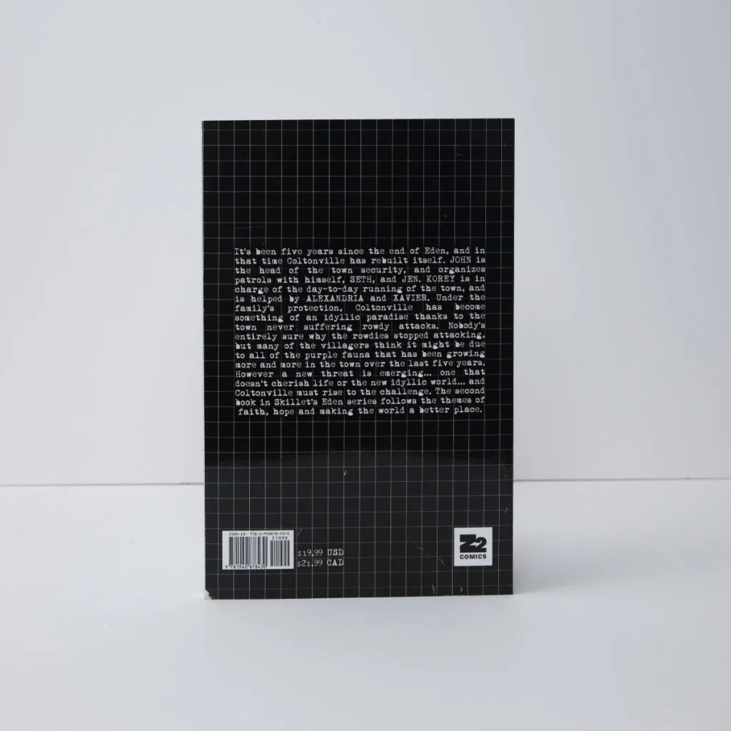 Black hardcover deluxe edition book with grid pattern and white text on the back cover for skillet eden ii five years