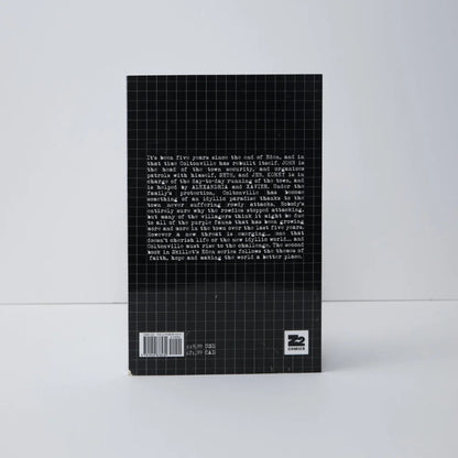 Black hardcover deluxe edition book with grid pattern and white text on the back cover for skillet eden ii five years