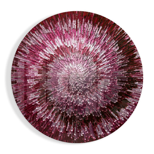 Circular glass wall art with radiating pink, magenta, and white glass rods creating a helix pattern from center outward, viewed straight-on against white background.