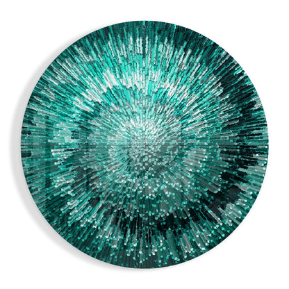 Circular glass wall art with radiating teal, emerald, and white rectangular pieces creating a starburst pattern from the center.