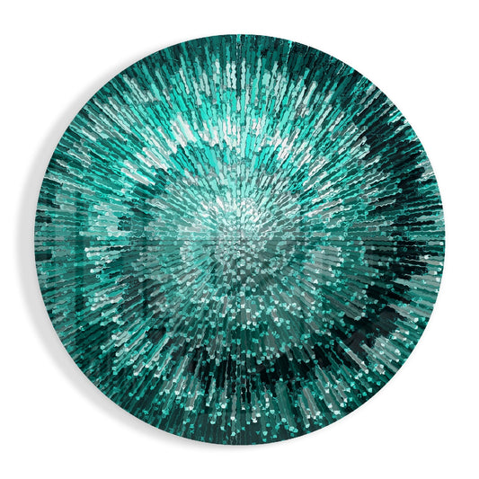 Circular glass wall art with radiating teal, emerald, and white rectangular pieces creating a starburst pattern from the center.