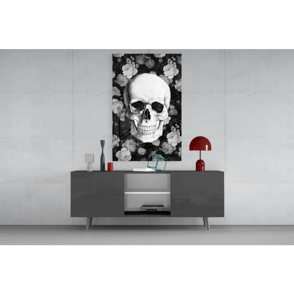 Black-and-white floral skull glass wall art on gray console
