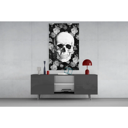 Black-and-white floral skull glass wall art on gray console