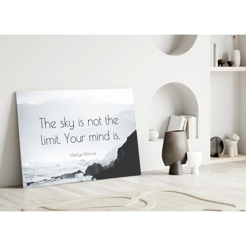 Minimalist black-and-white glass wall art canvas print with the sky is not the limit quote
