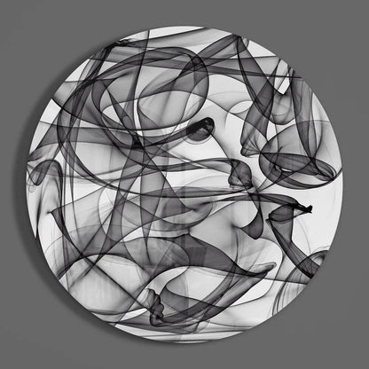 Swirling black and white tempered glass art with size comparison