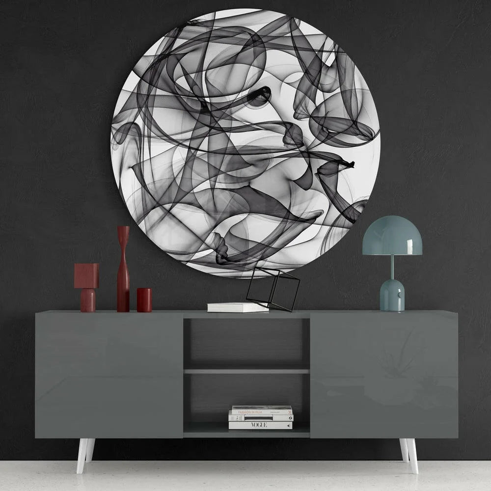 Swirling black and white tempered glass art with size comparison