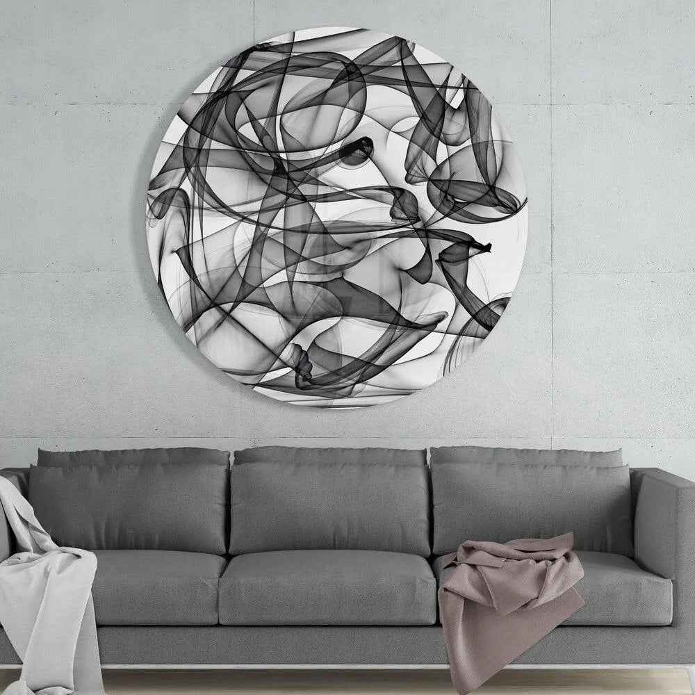 Swirling black and white tempered glass art with size comparison