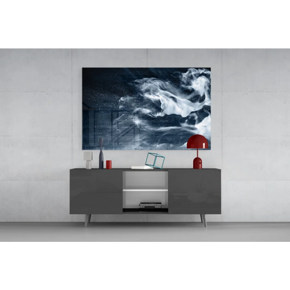 Modern glass wall art print with swirling white and dark blue cosmic patterns