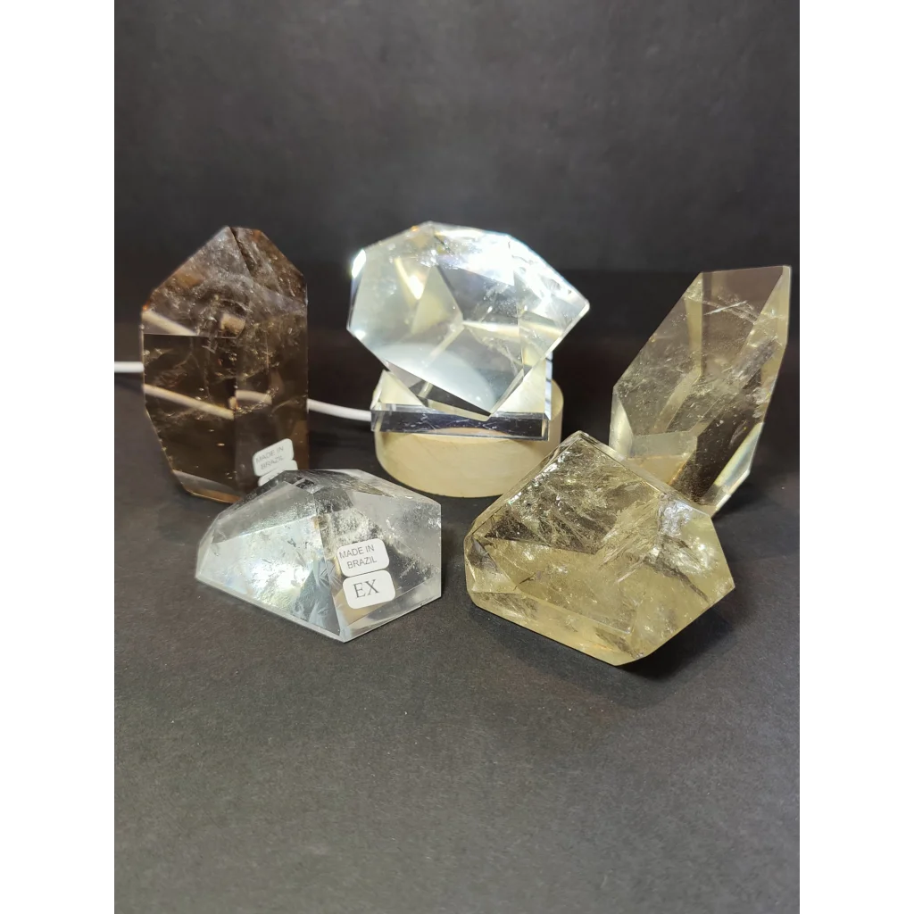 Smoky clear quartz polished free form sculpture with faceted clear quartz and visible internal inclusions