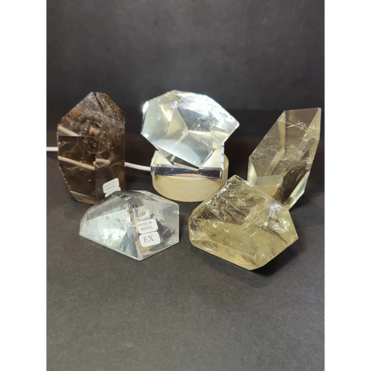 Smoky clear quartz polished free form sculpture with faceted clear quartz and visible internal inclusions