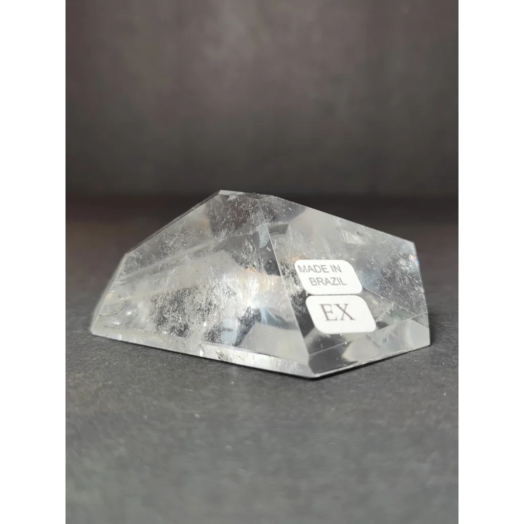 Smoky clear quartz polished free form sculpture featuring a clear faceted quartz crystal with natural inclusions