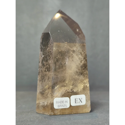 Smoky clear quartz polished free form sculpture tower in golden brown with natural inclusions made in brazil