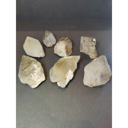 Smoky quartz natural elestial points featuring clear quartz natural crystals with jagged edges and subtle brown inclusions