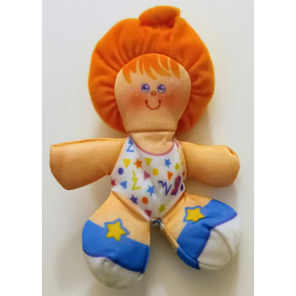 Smooshees Cuddler Cuties Sandy plush doll with orange body, yellow hair and blue pants