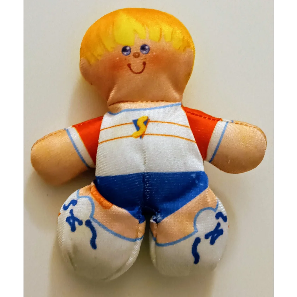 Smooshees Cuddler Seth plush toy with blonde hair and smiling face