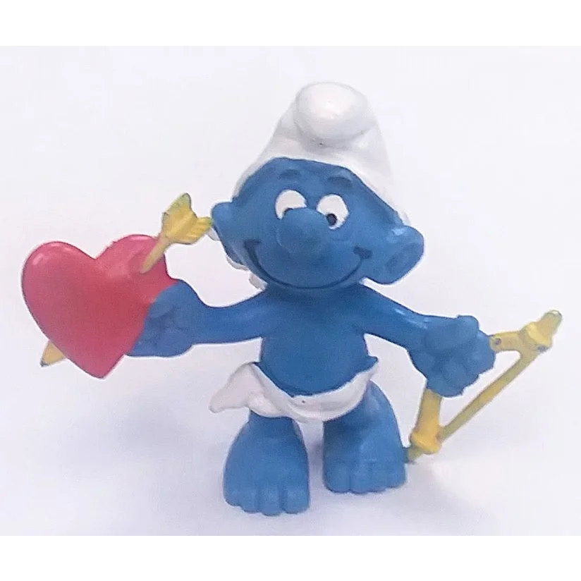 Vintage 1981 Valentine Smurf figurine with heart and bow