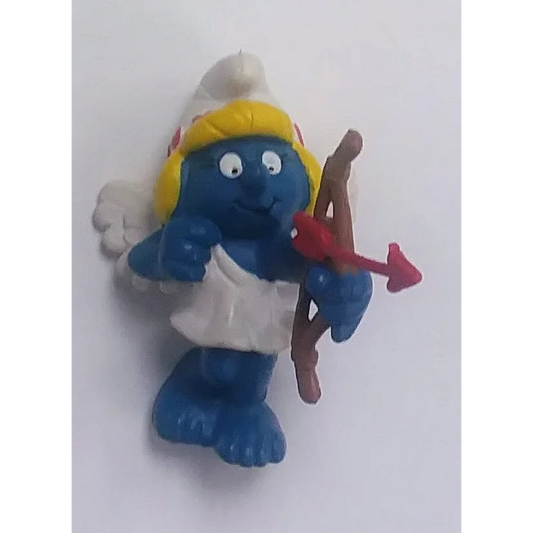 Rare 1982 Valentine Smurfette PVC figure with blonde hair, white dress, red arrow