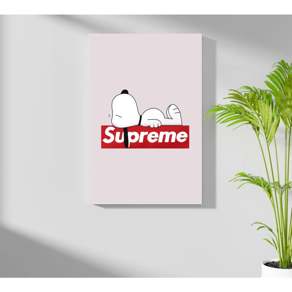 Snoopy resting on bold red Supreme logo, soft pink background aluminum print