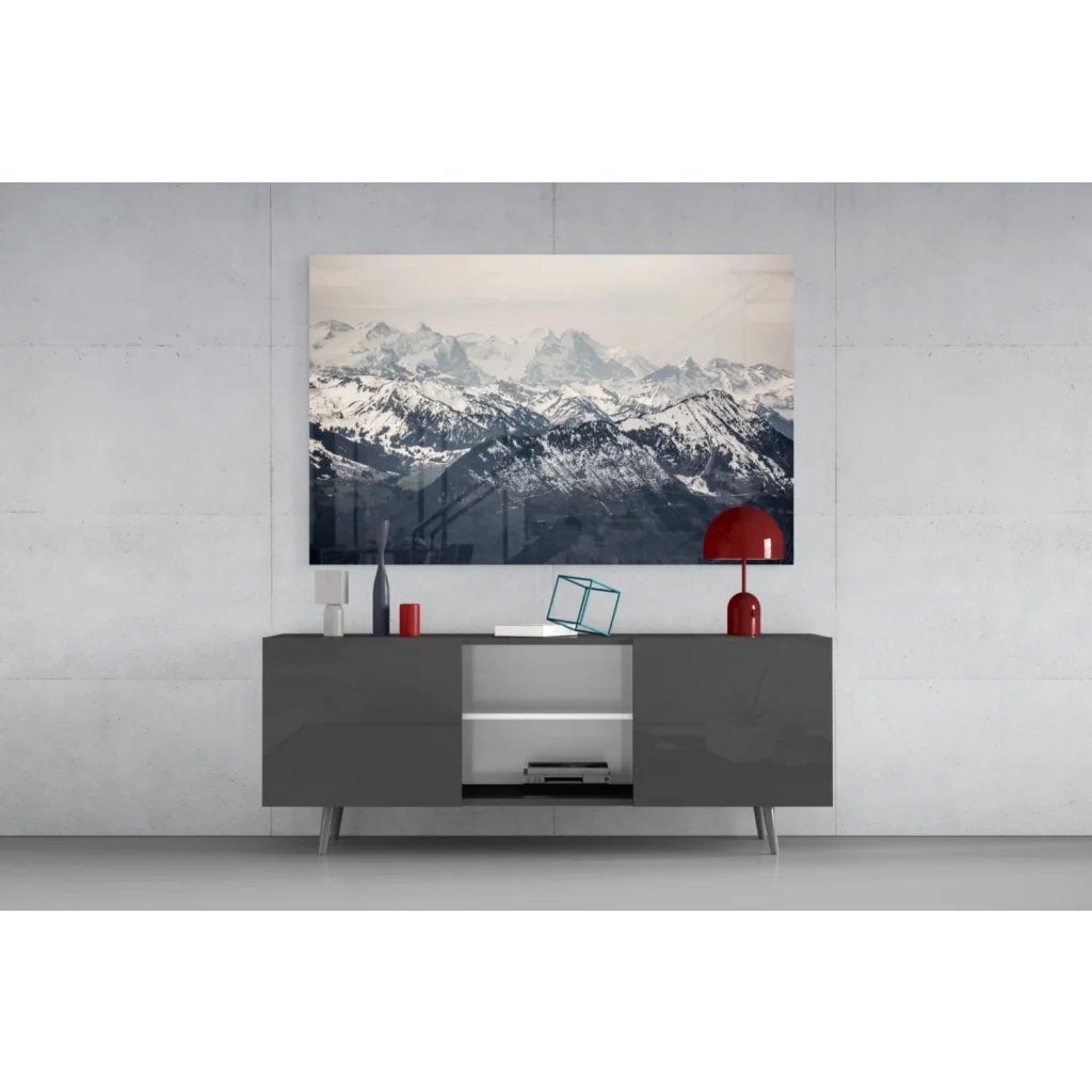 Modern gray console table with glossy finish and sleek legs under glass wall art