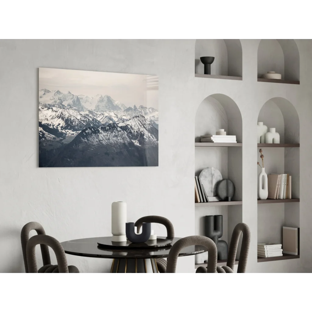 Framed black-and-white snow-capped mountains glass wall art on white wall