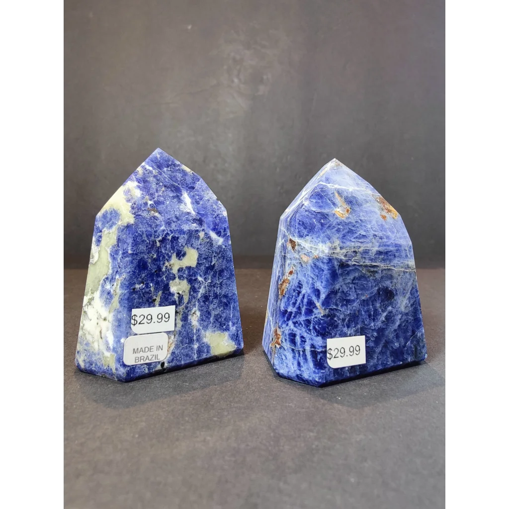Two polished blue and white sodalite polished obelisk bookends with natural mineral inclusions for display use