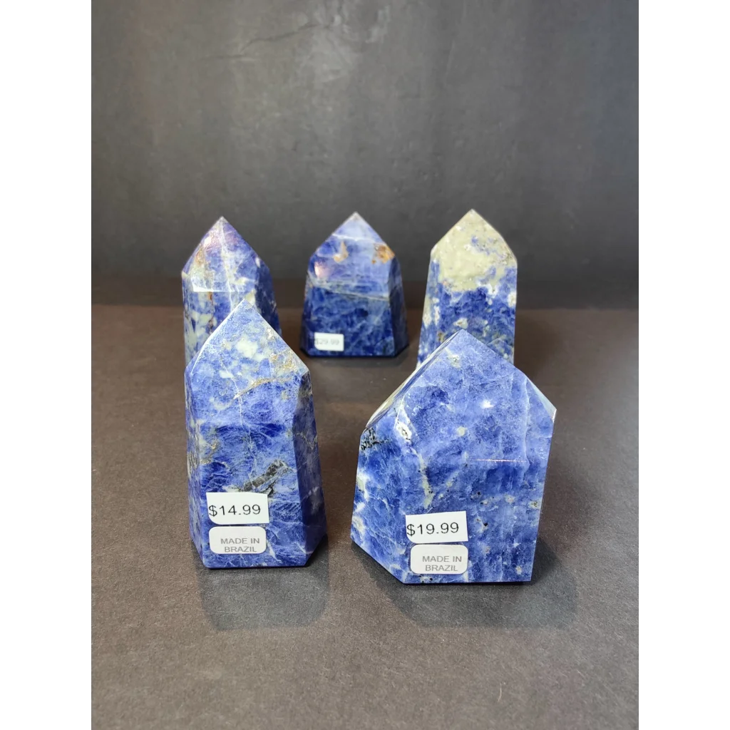 Blue sodalite polished obelisk tower sculpture with natural mineral inclusions and polished facets