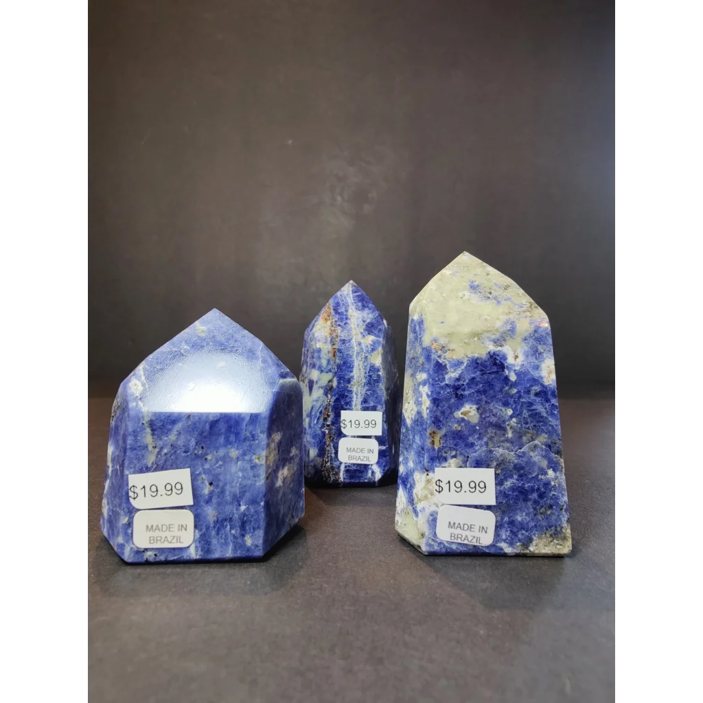 Three polished blue sodalite polished obelisk tower sculptures with white and yellow veining made in brazil priced 1999