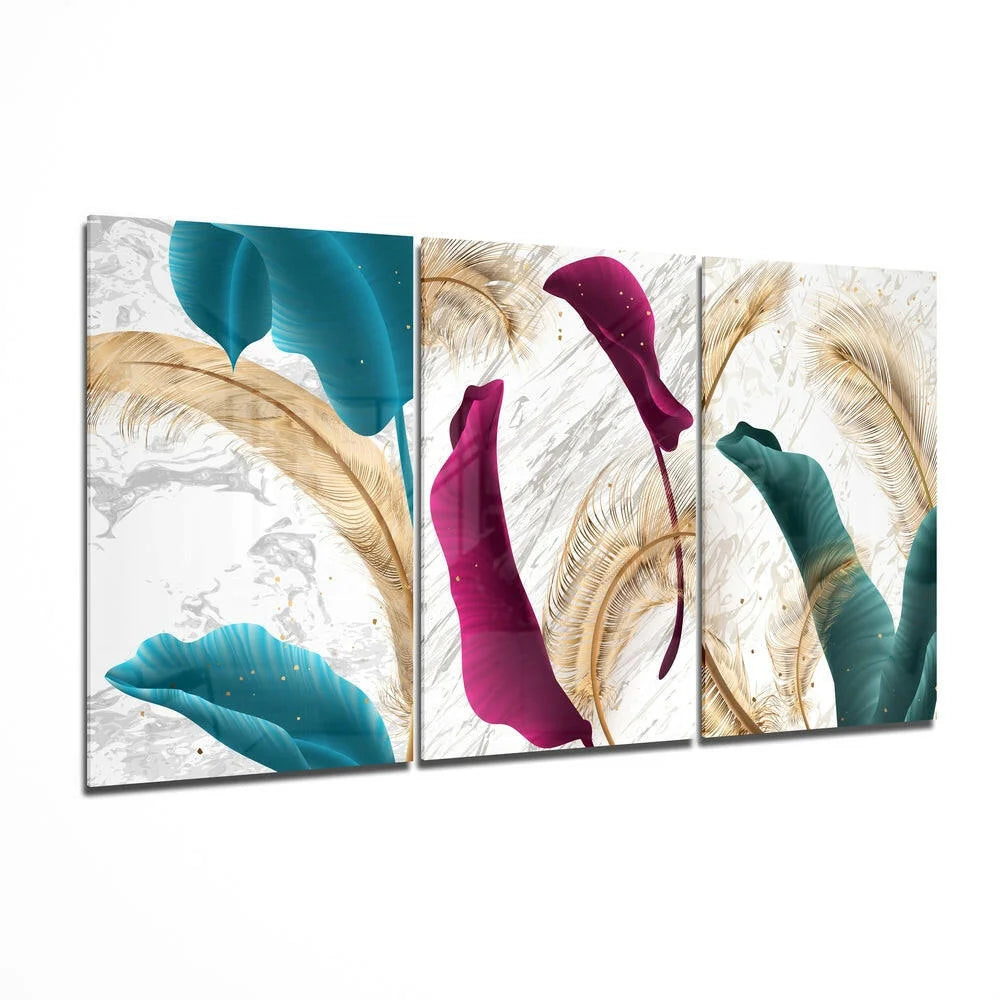 Three-panel glass wall art with teal magenta emerald leaves on marble white background